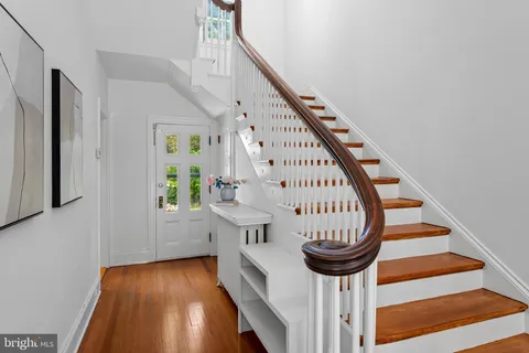 a large bedroom with a bed and window