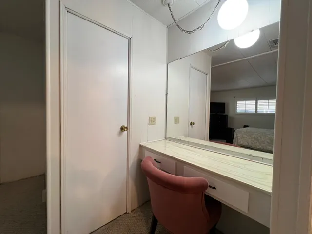 a room with a sink and a mirror