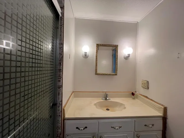 a bathroom with a sink and a mirror