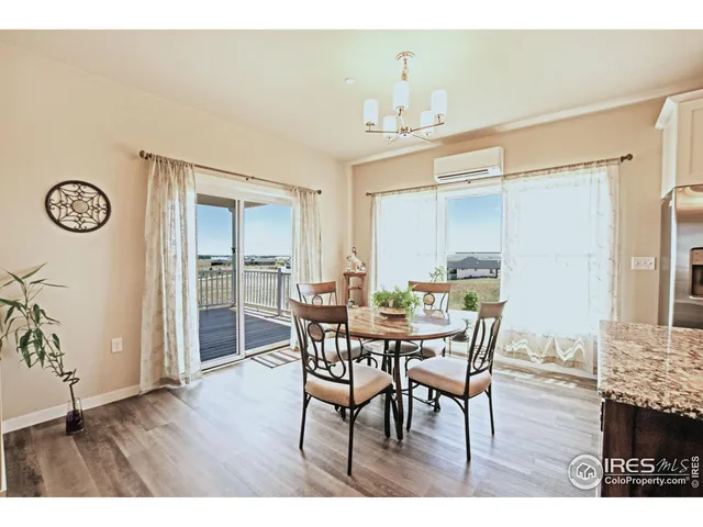 a kitchen with a dining table chairs and view kitchen