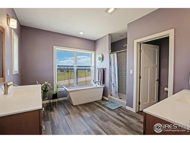 a living room with furniture a window and a flat screen tv