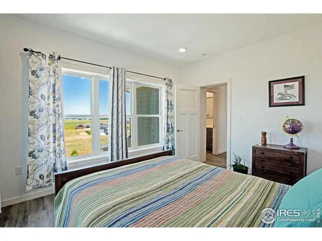 a bathroom with a sink a toilet a mirror a bathtub and shower