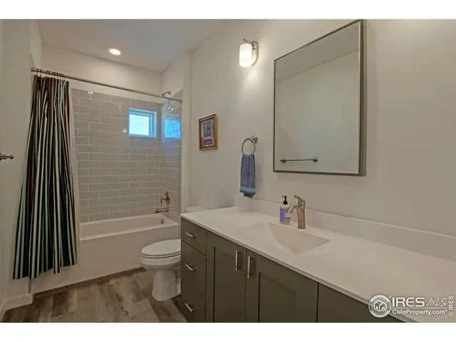 a bathroom with a sink a vanity and a mirror
