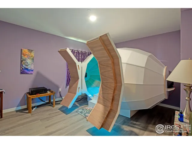 a view of a livingroom with furniture and an entryway