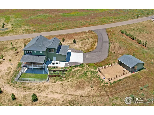 a view of a ocean with a bench in balcony
