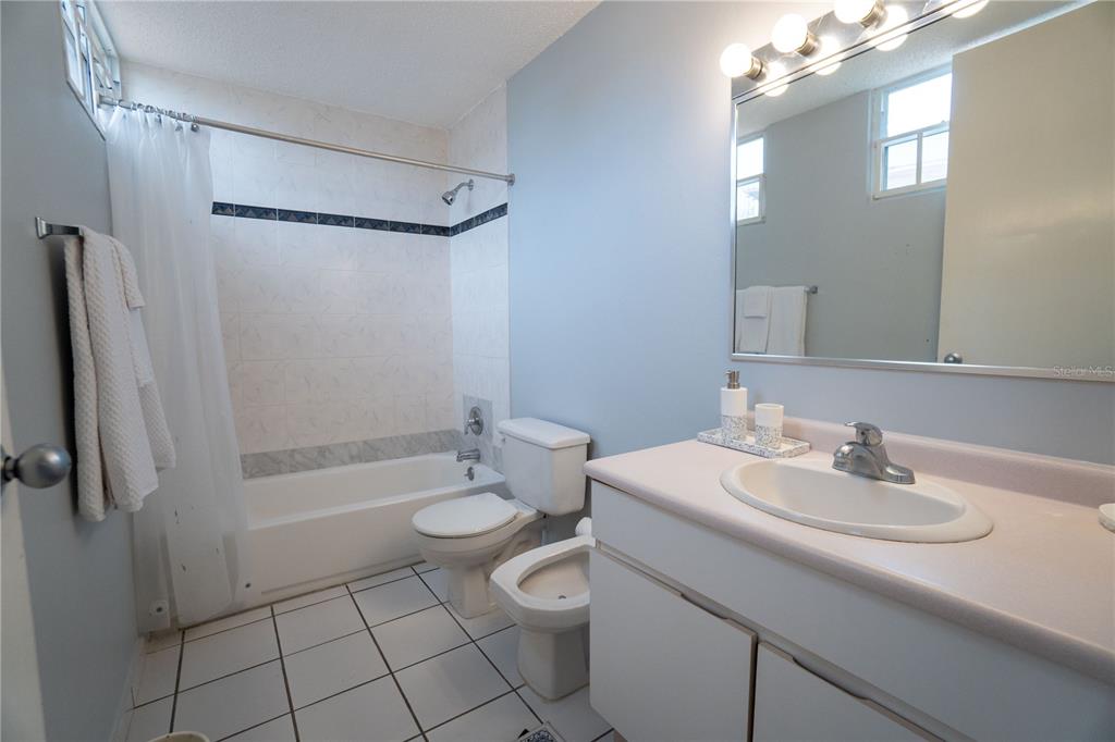 Cond Caparra Chalets Cond Caparra Chalets 8th, Unit 2A1 Guaynabo, PR 00966 - Photo 11 of 25 a bathroom with a sink a toilet and shower