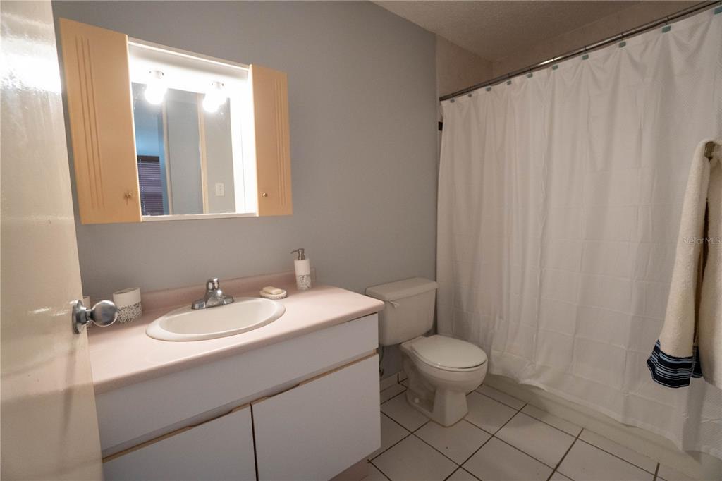 Cond Caparra Chalets Cond Caparra Chalets 8th, Unit 2A1 Guaynabo, PR 00966 - Photo 14 of 25 a bathroom with a sink a toilet and a mirror
