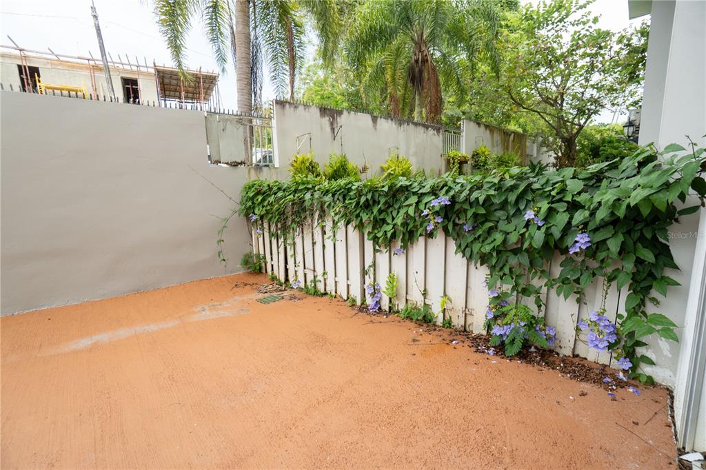 Cond Caparra Chalets Cond Caparra Chalets 8th, Unit 2A1 Guaynabo, PR 00966 - Photo 15 of 25 a view of a house with a small yard