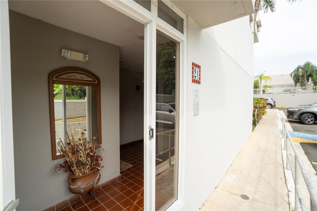 Cond Caparra Chalets Cond Caparra Chalets 8th, Unit 2A1 Guaynabo, PR 00966 - Photo 18 of 25 a front view of a house with a porch