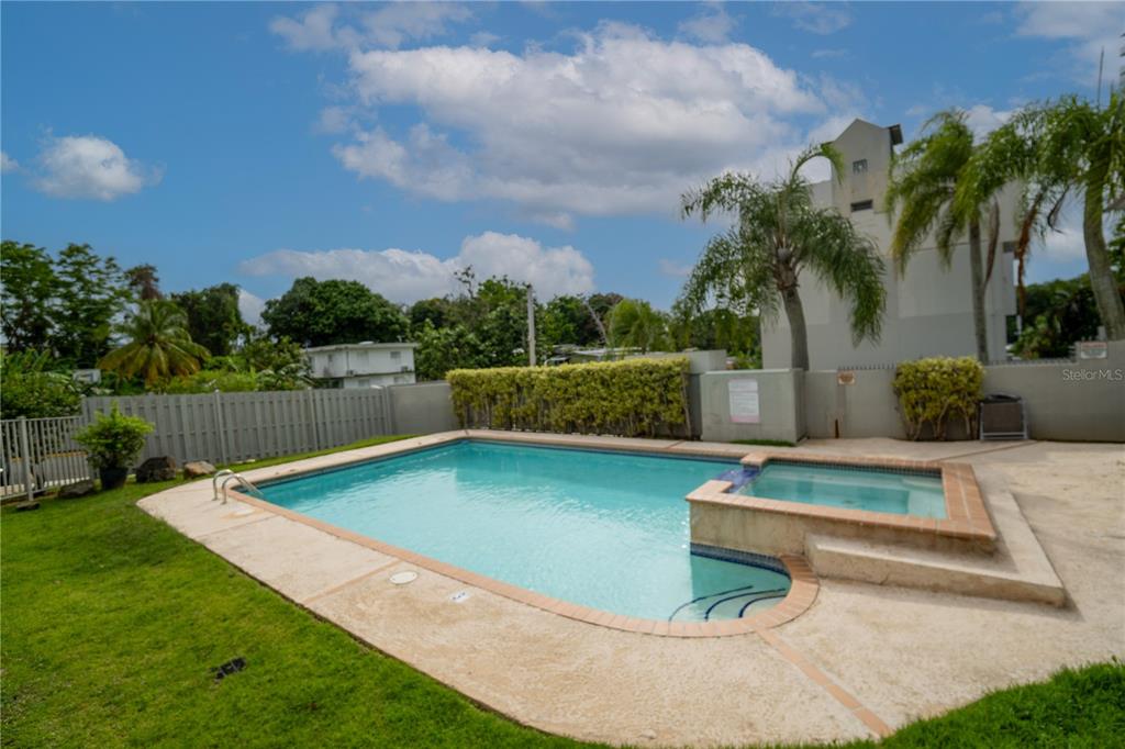 Cond Caparra Chalets Cond Caparra Chalets 8th, Unit 2A1 Guaynabo, PR 00966 - Photo 20 of 25 a view of a swimming pool with a patio