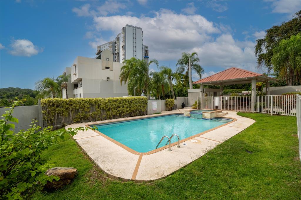 Cond Caparra Chalets Cond Caparra Chalets 8th, Unit 2A1 Guaynabo, PR 00966 - Photo 21 of 25 an aerial view of a house with swimming pool garden and lake view