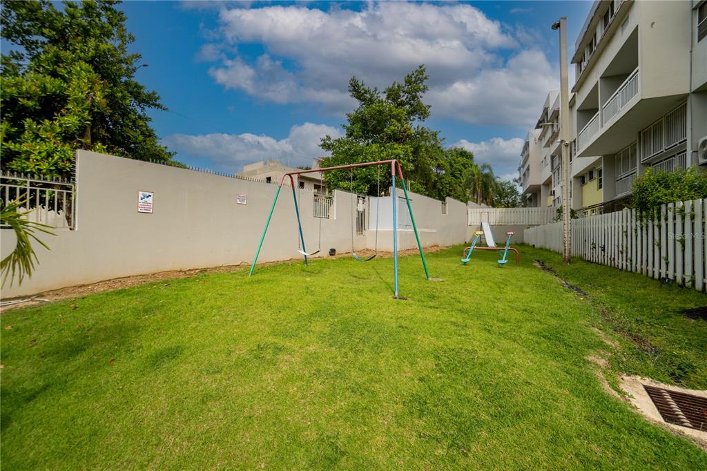 Cond Caparra Chalets Cond Caparra Chalets 8th, Unit 2A1 Guaynabo, PR 00966 - Photo 23 of 25 a view of a house with a backyard