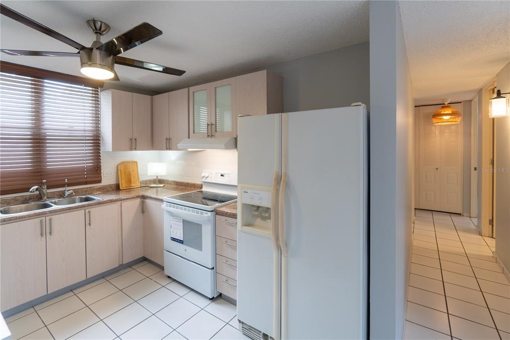 Cond Caparra Chalets Cond Caparra Chalets 8th, Unit 2A1 Guaynabo, PR 00966 - Photo 8 of 25 a kitchen with appliances cabinets and a sink