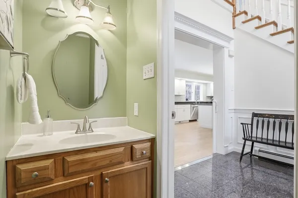 a bathroom with a sink a mirror and a shower