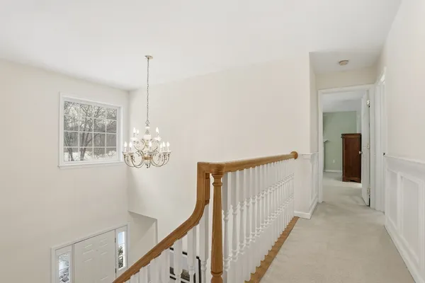 a view of a hallway with windows