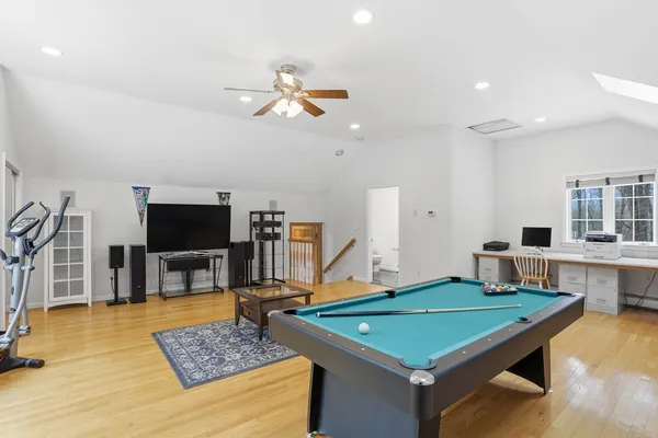 a room with pool table and flat screen tv