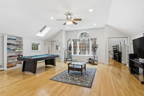 a living room with furniture a rug and a flat screen tv