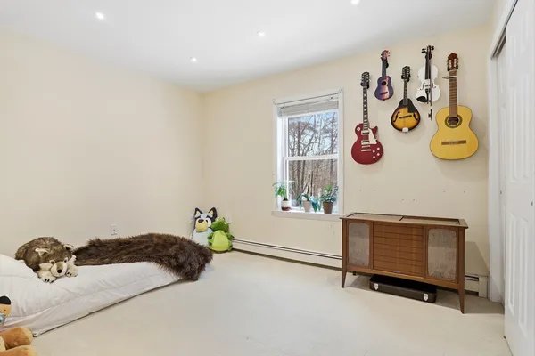 a bedroom with a bed and a table