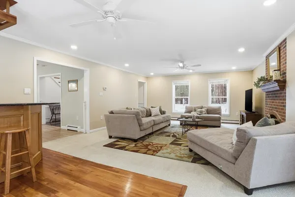 a living room with furniture windows and a fireplace
