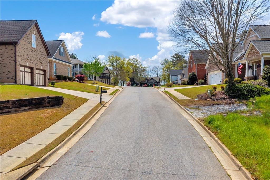 9131 Golfview Lane Covington, GA 30014 - Photo 13 of 19 a view of residential houses with yard and swimming pool
