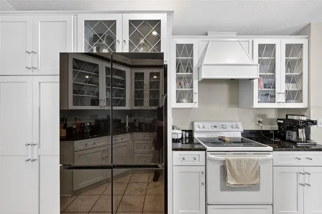 a kitchen with a stove and a refrigerator