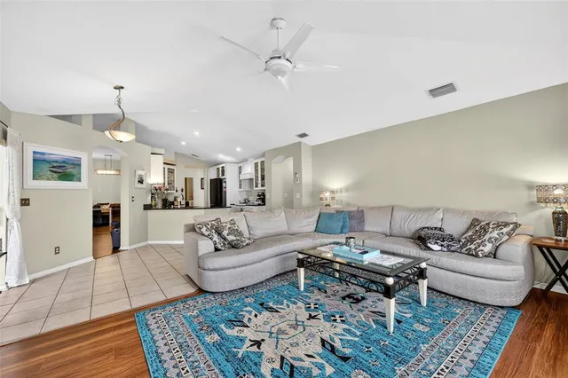 a living room with furniture and a rug