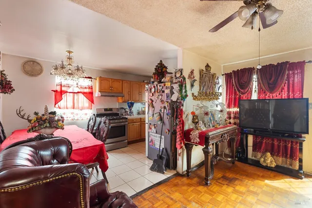 a bedroom with furniture and a flat screen tv