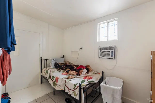 a reading room with furniture and a window