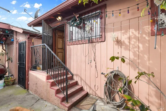 a view of entryway with wooden floor
