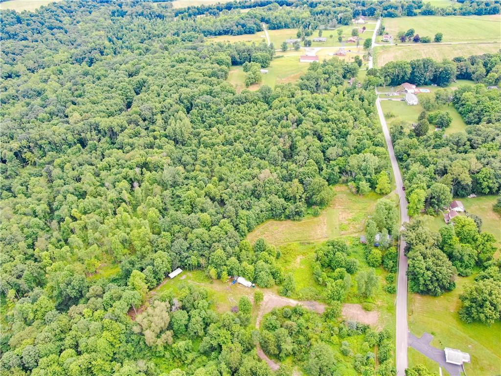 Lot # 5 Hillsville Road Edinburg, PA 16116 - Photo 6 of 9 a view of a lake with a house