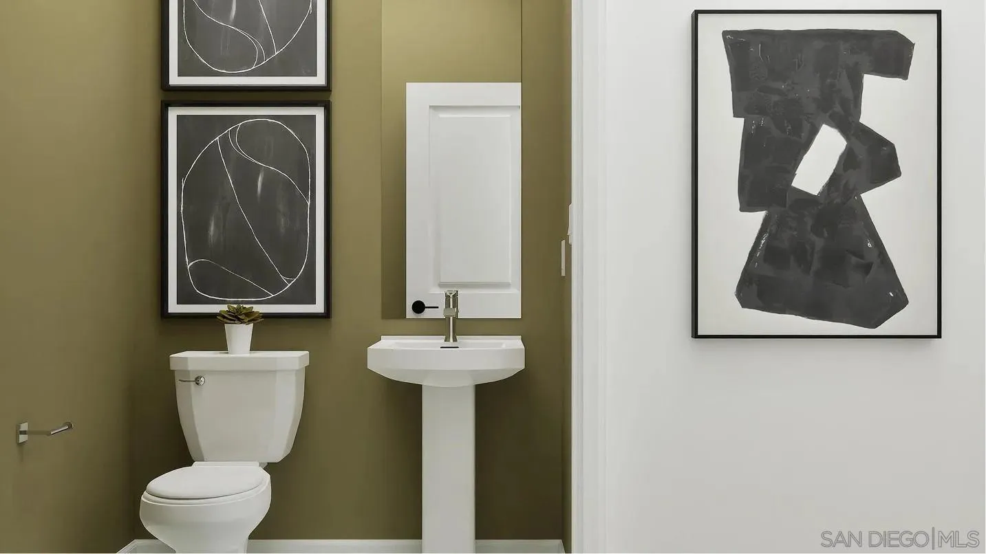 1702 Jacob Court El Cajon, CA 92021 - Photo 15 of 15 a bathroom with a toilet sink and mirror