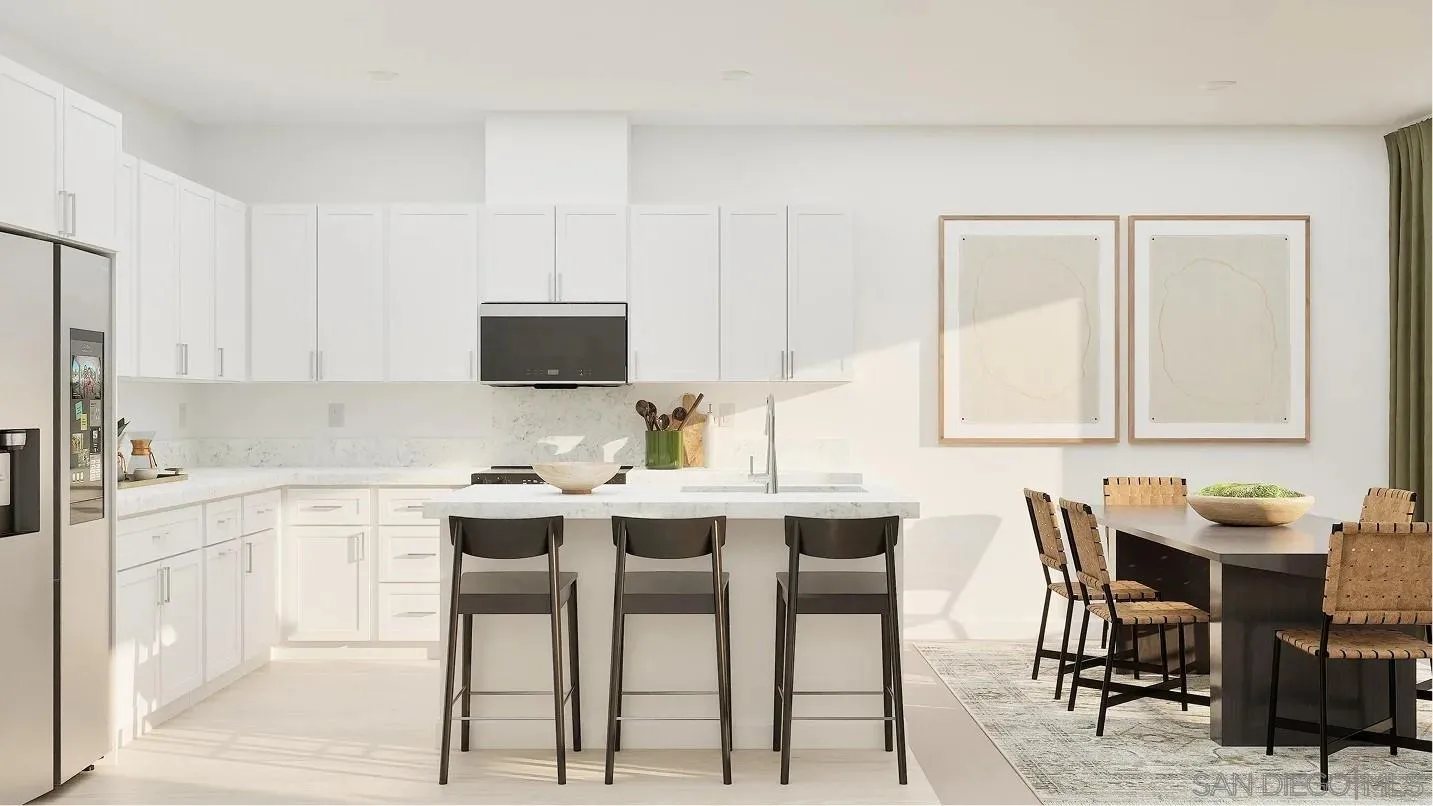 1702 Jacob Court El Cajon, CA 92021 - Photo 2 of 15 a kitchen with stainless steel appliances kitchen island granite countertop a table and chairs in it