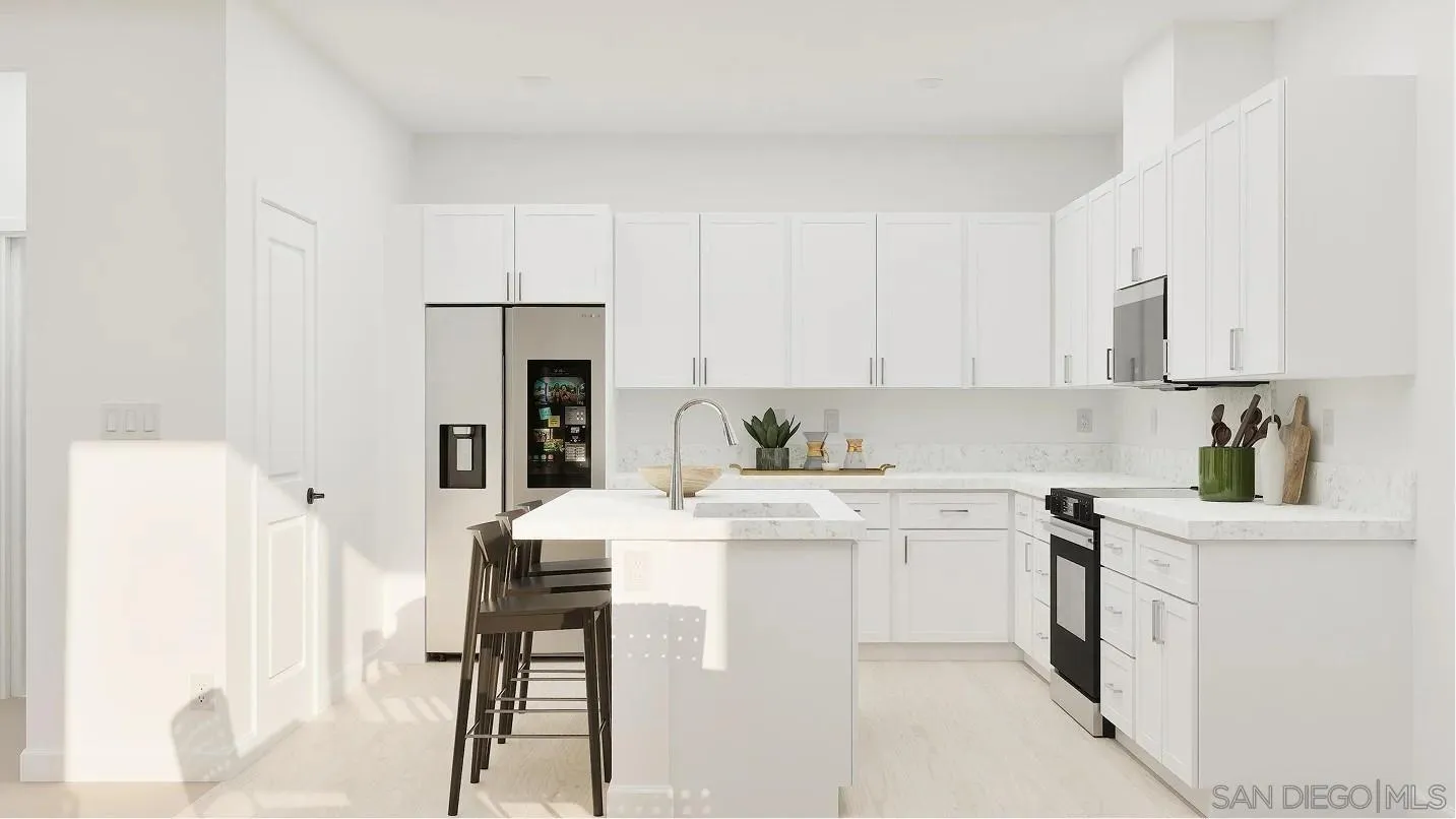 1702 Jacob Court El Cajon, CA 92021 - Photo 3 of 15 a kitchen with stainless steel appliances white cabinets and a refrigerator