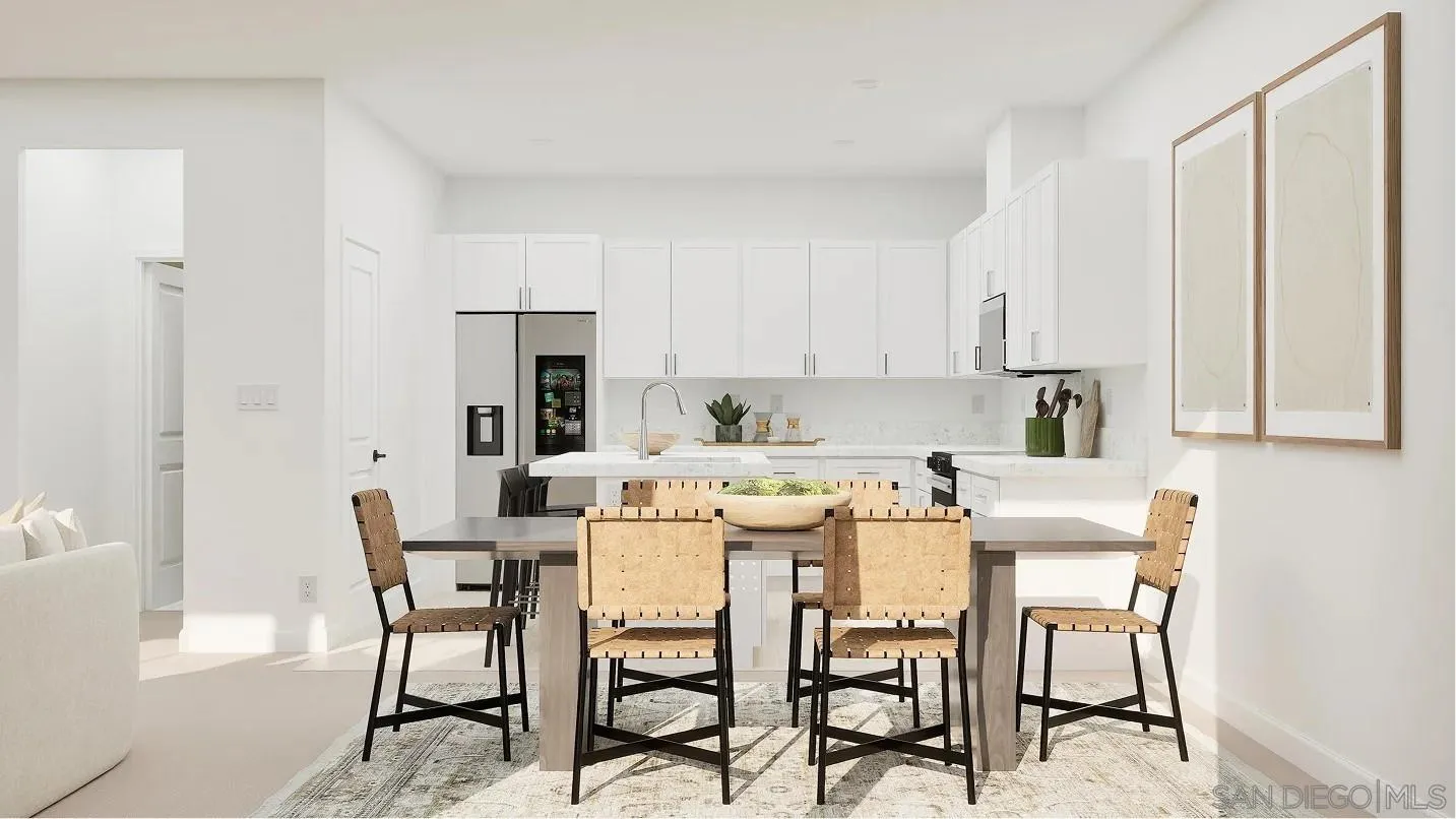 1702 Jacob Court El Cajon, CA 92021 - Photo 4 of 15 a kitchen with a dining table chairs and white cabinets