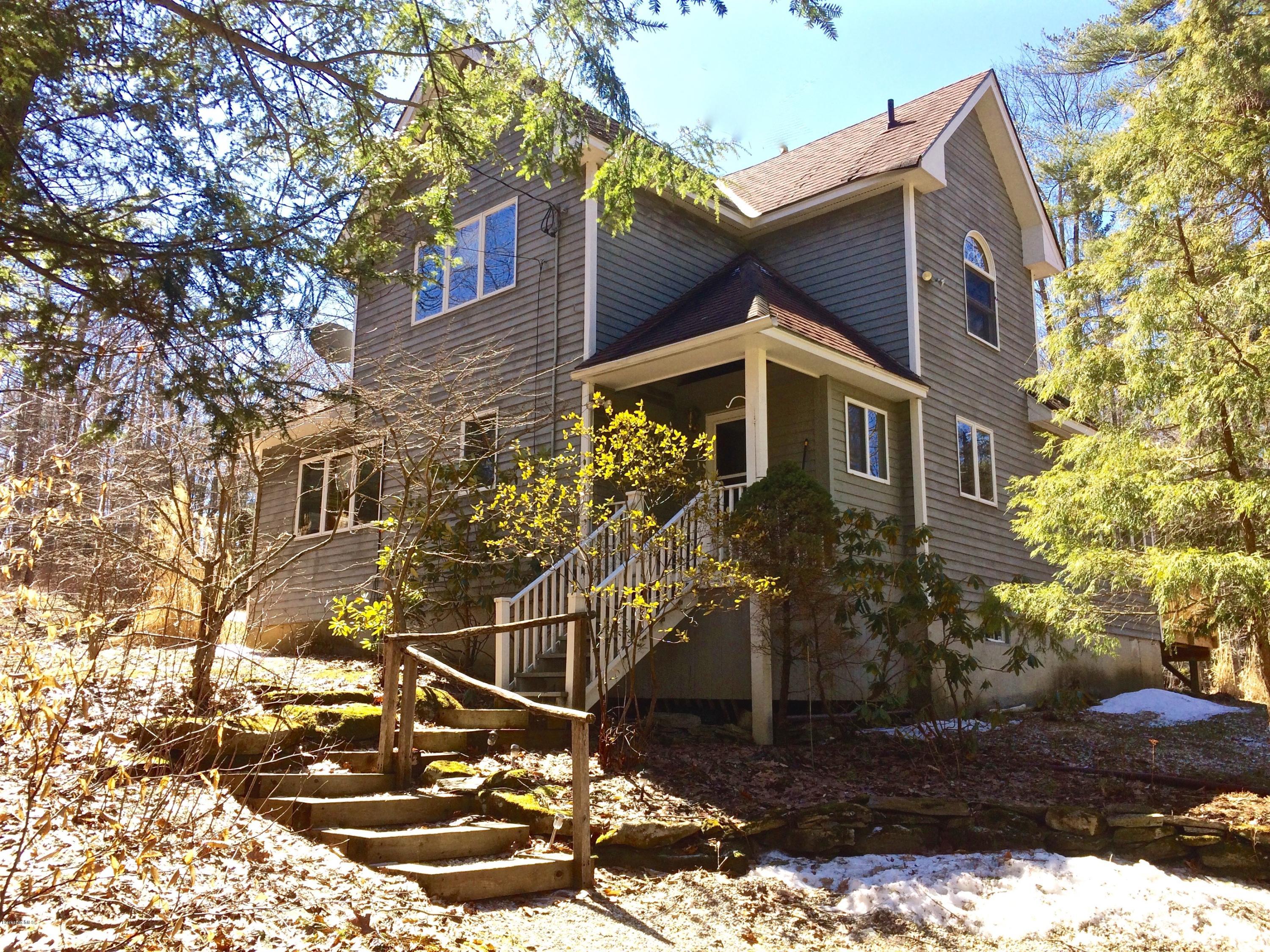 64 Monterey Road Tyringham, MA 01264 - Photo 1 of 26 a view of a house with a yard