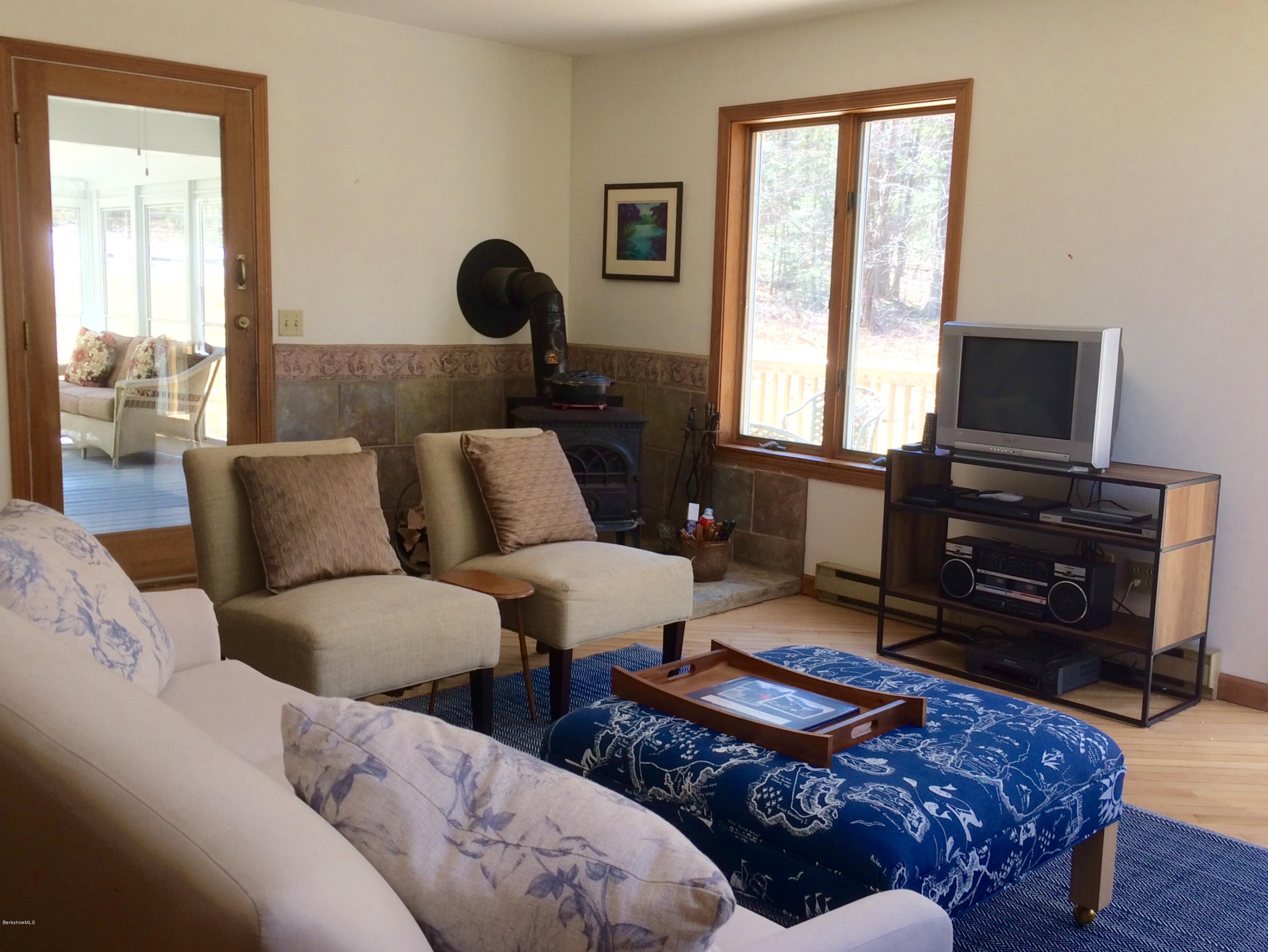 64 Monterey Road Tyringham, MA 01264 - Photo 11 of 26 a living room with furniture and a flat screen tv