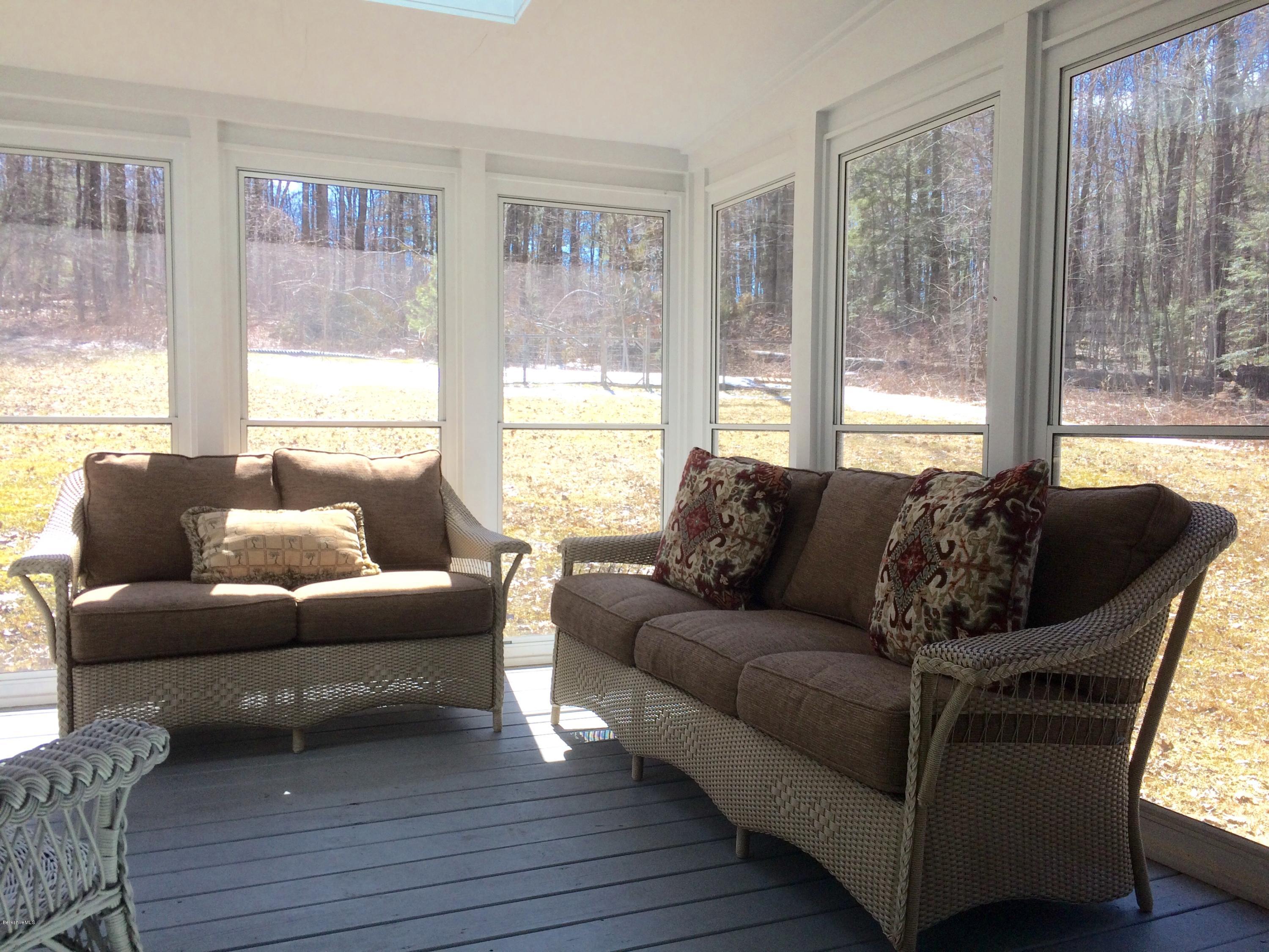 64 Monterey Road Tyringham, MA 01264 - Photo 12 of 26 a living room with furniture and a large window