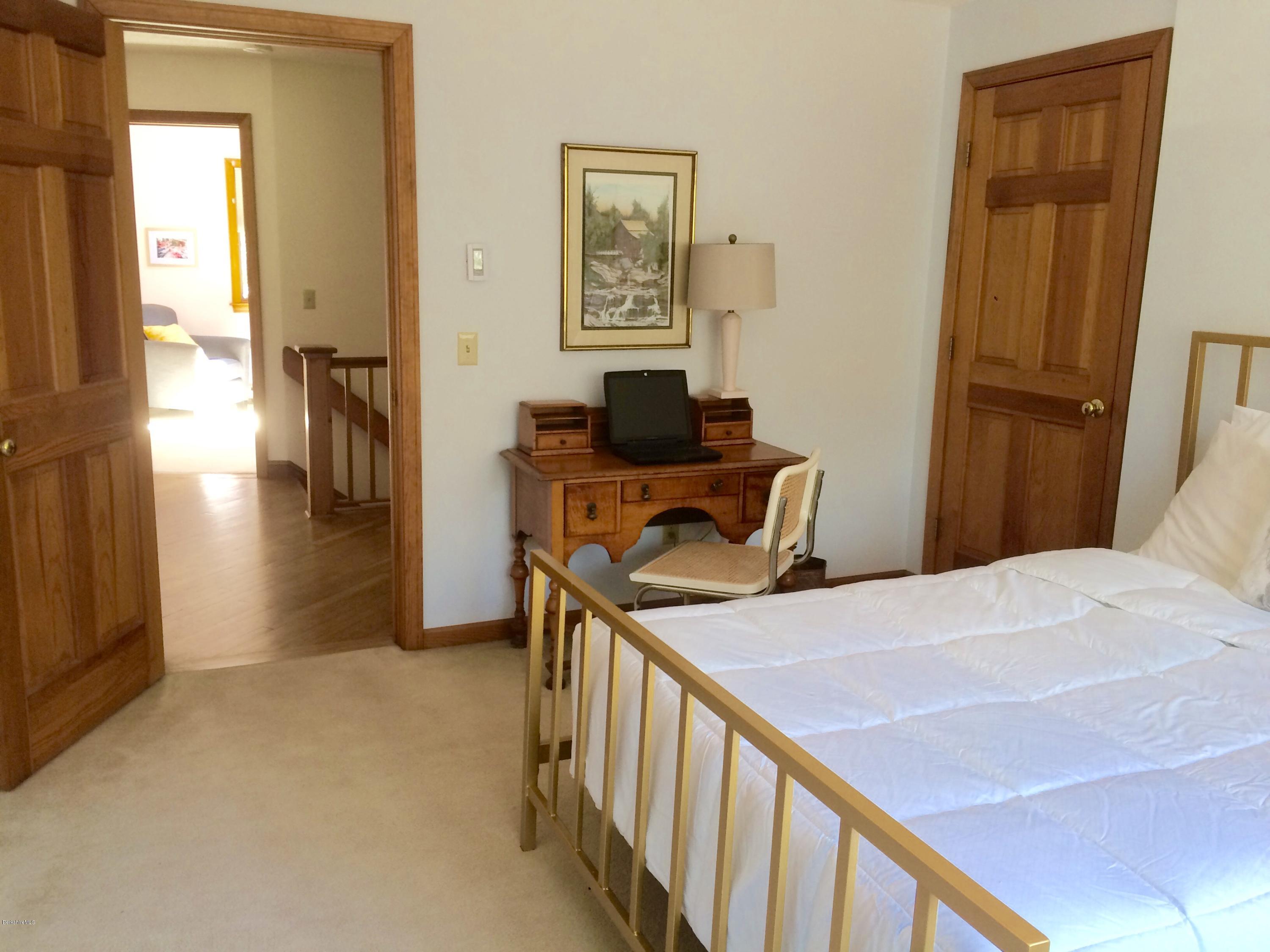 64 Monterey Road Tyringham, MA 01264 - Photo 20 of 26 a view of a hallway with workspace and a window
