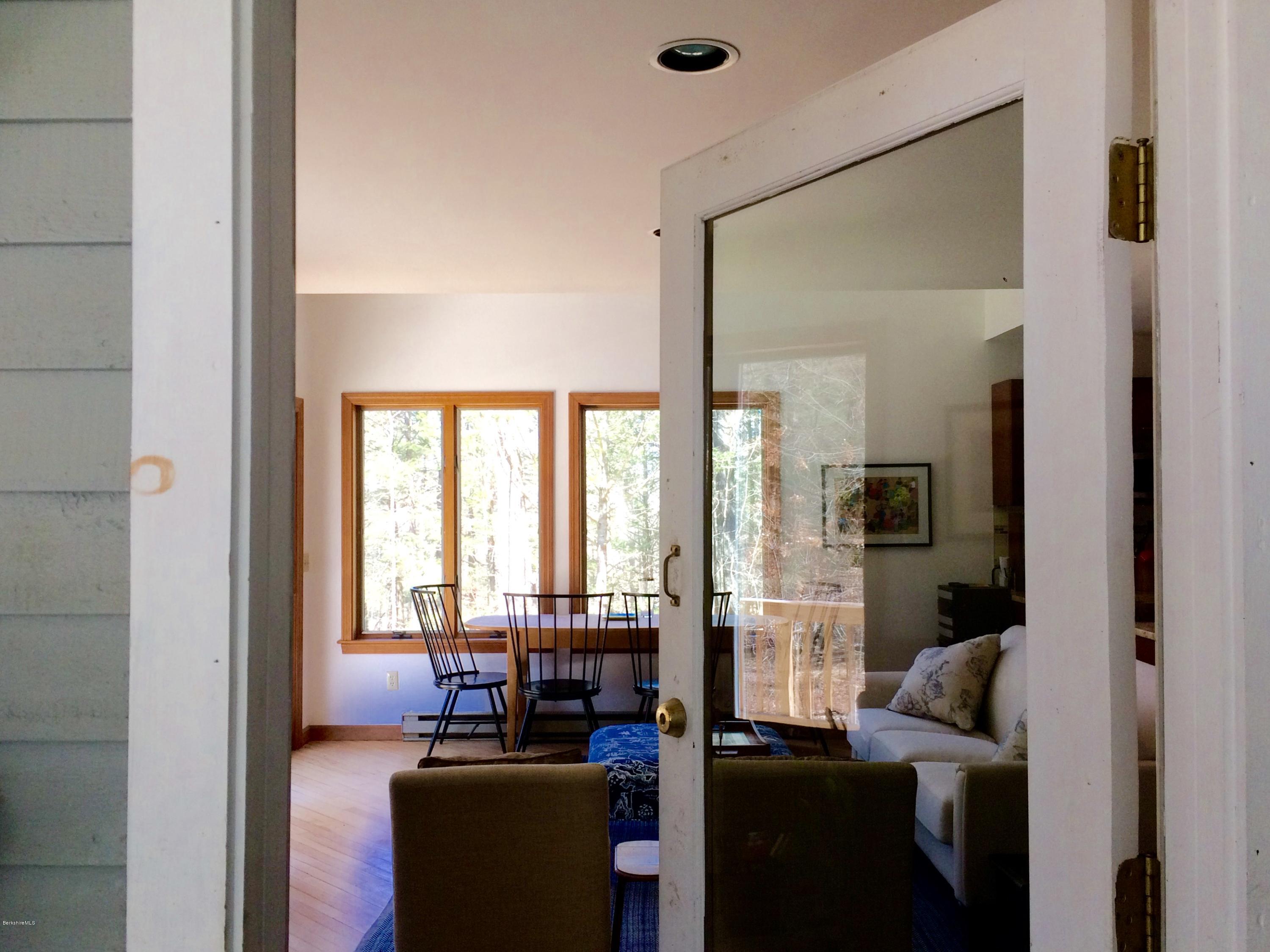 64 Monterey Road Tyringham, MA 01264 - Photo 3 of 26 a living room with furniture and a large window