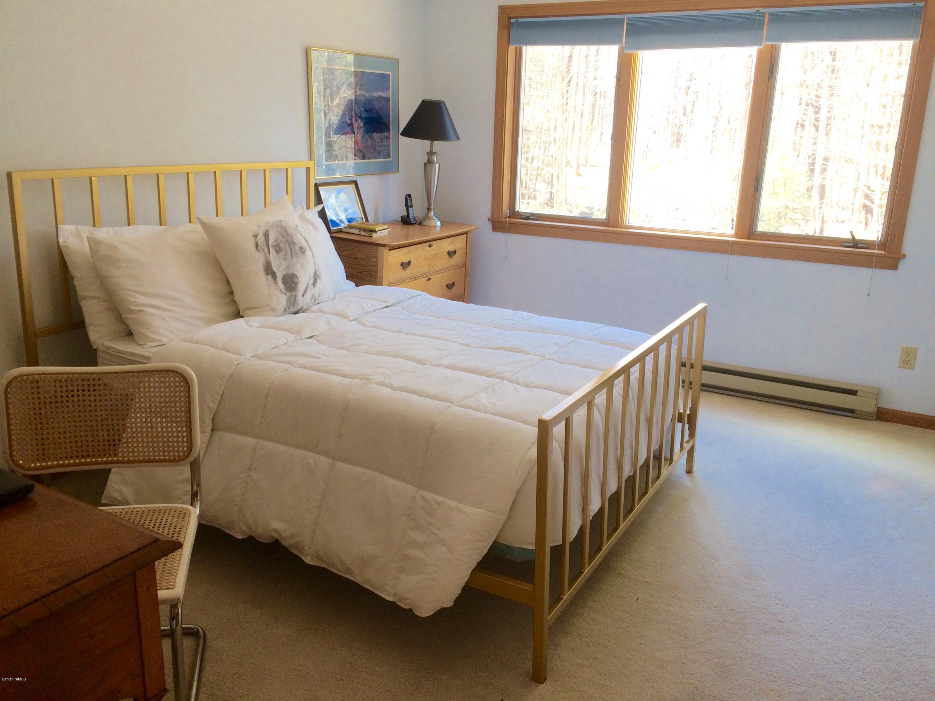 64 Monterey Road Tyringham, MA 01264 - Photo 21 of 26 a bedroom with a bed and a window