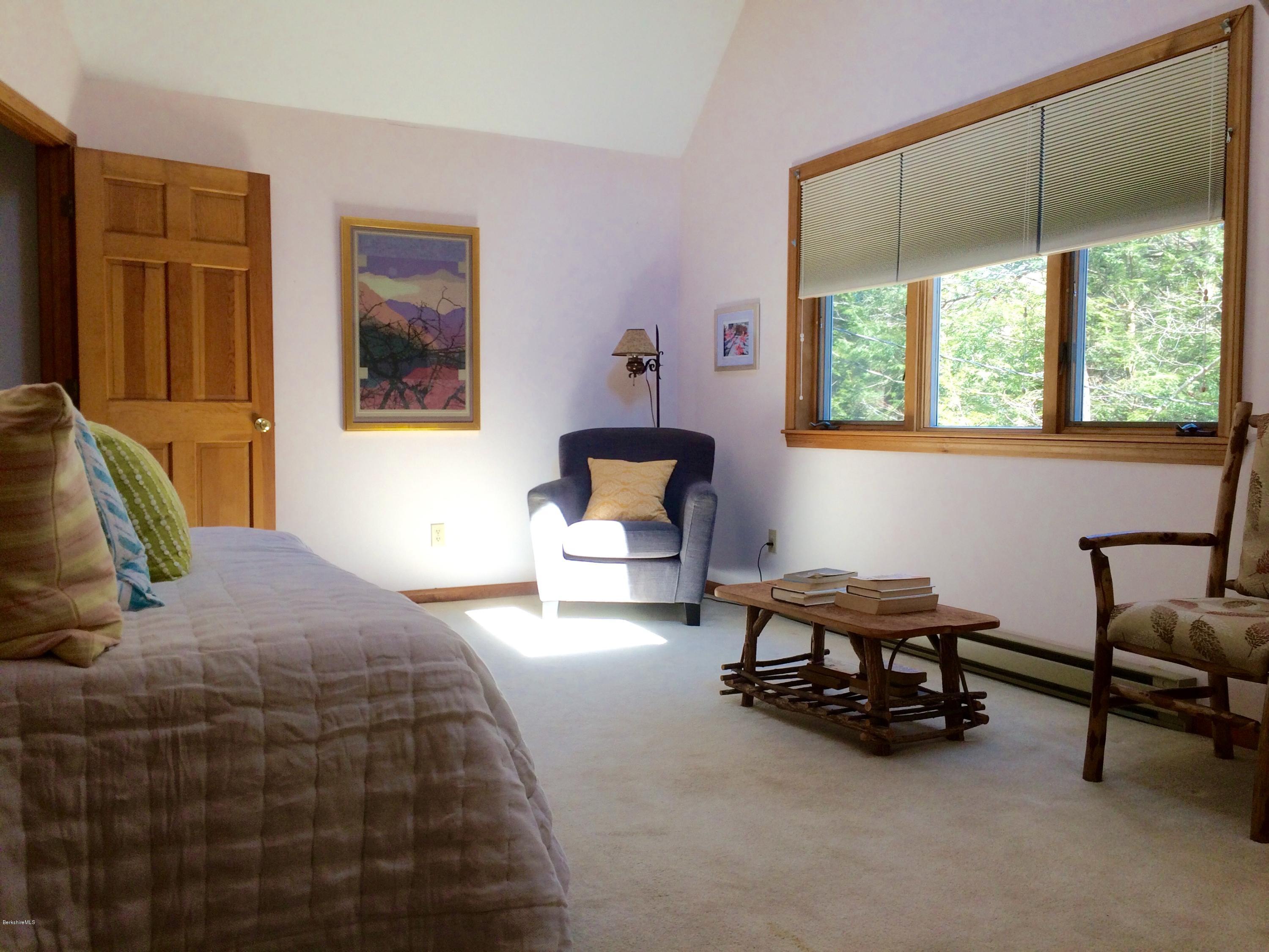 64 Monterey Road Tyringham, MA 01264 - Photo 22 of 26 a bedroom with bed and a window