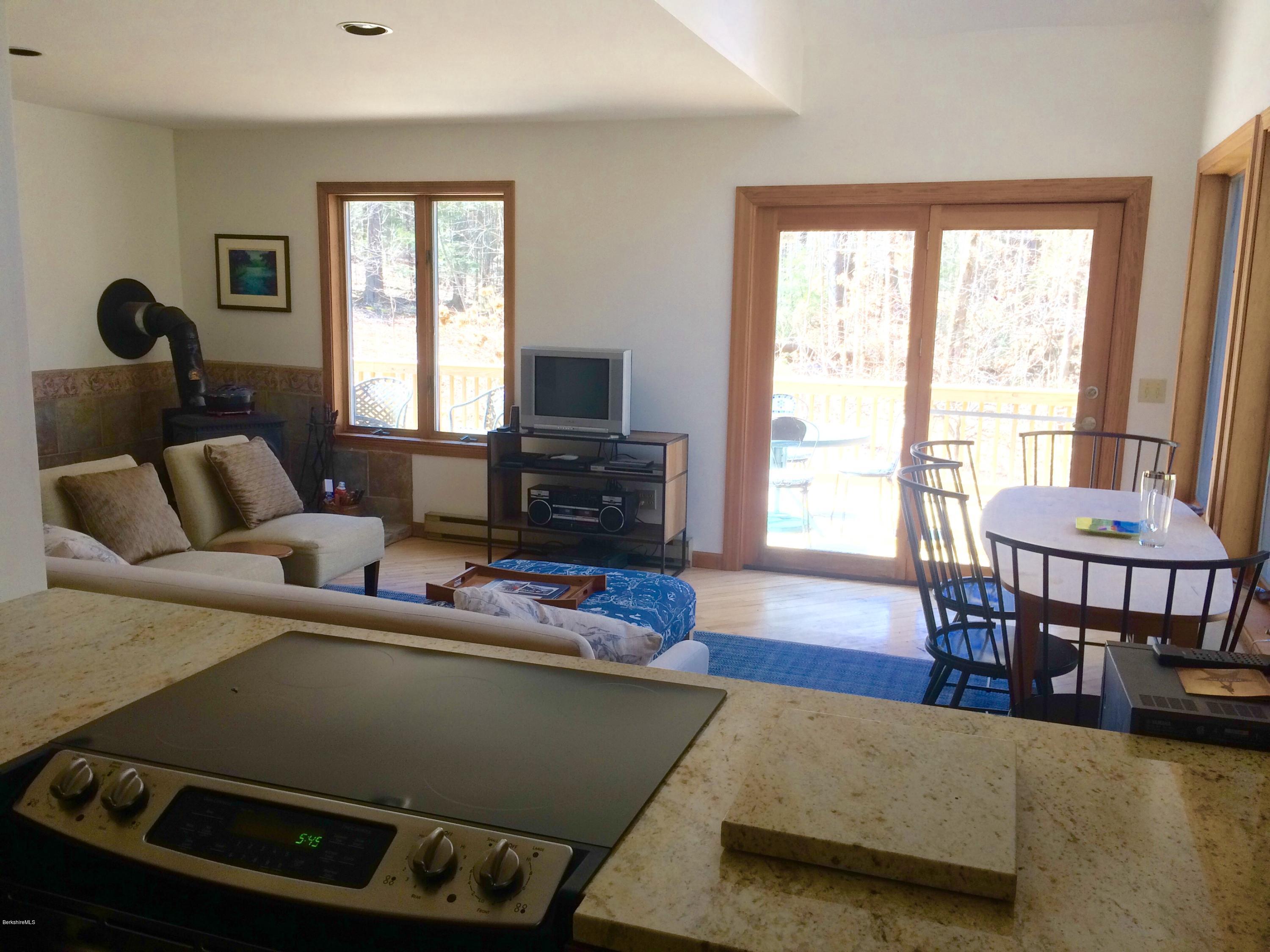 64 Monterey Road Tyringham, MA 01264 - Photo 4 of 26 a living room with furniture and a flat screen tv
