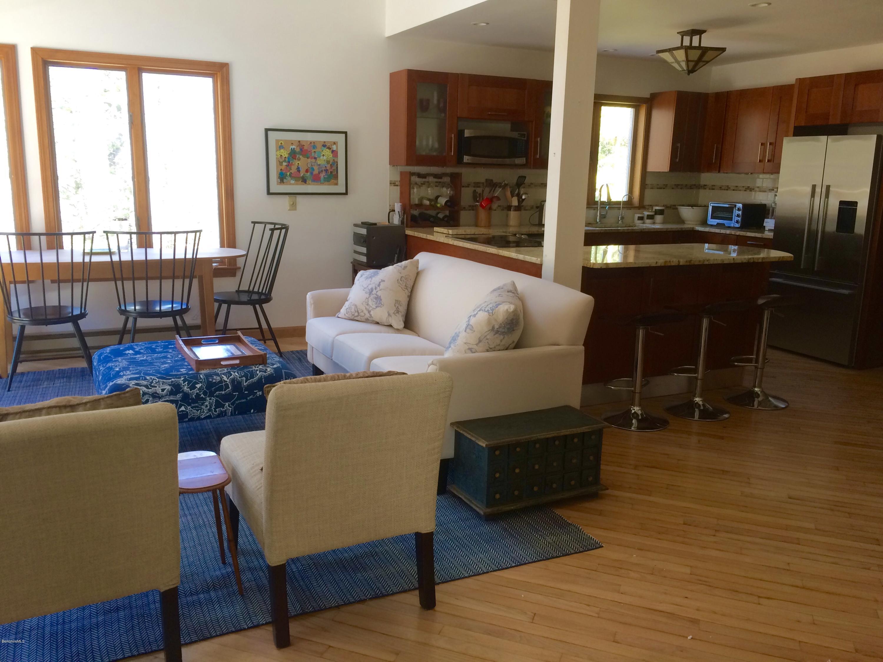 64 Monterey Road Tyringham, MA 01264 - Photo 6 of 26 a living room with furniture and a large window