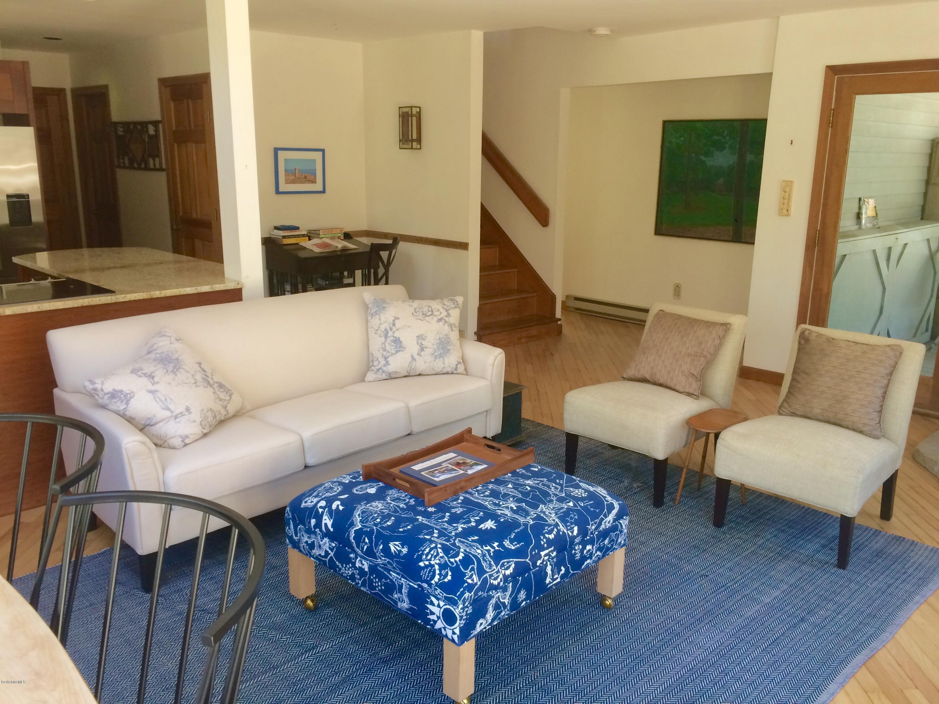 64 Monterey Road Tyringham, MA 01264 - Photo 10 of 26 a living room with furniture and a flat screen tv
