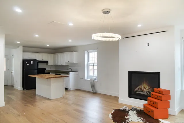 a view of kitchen and wooden floor
