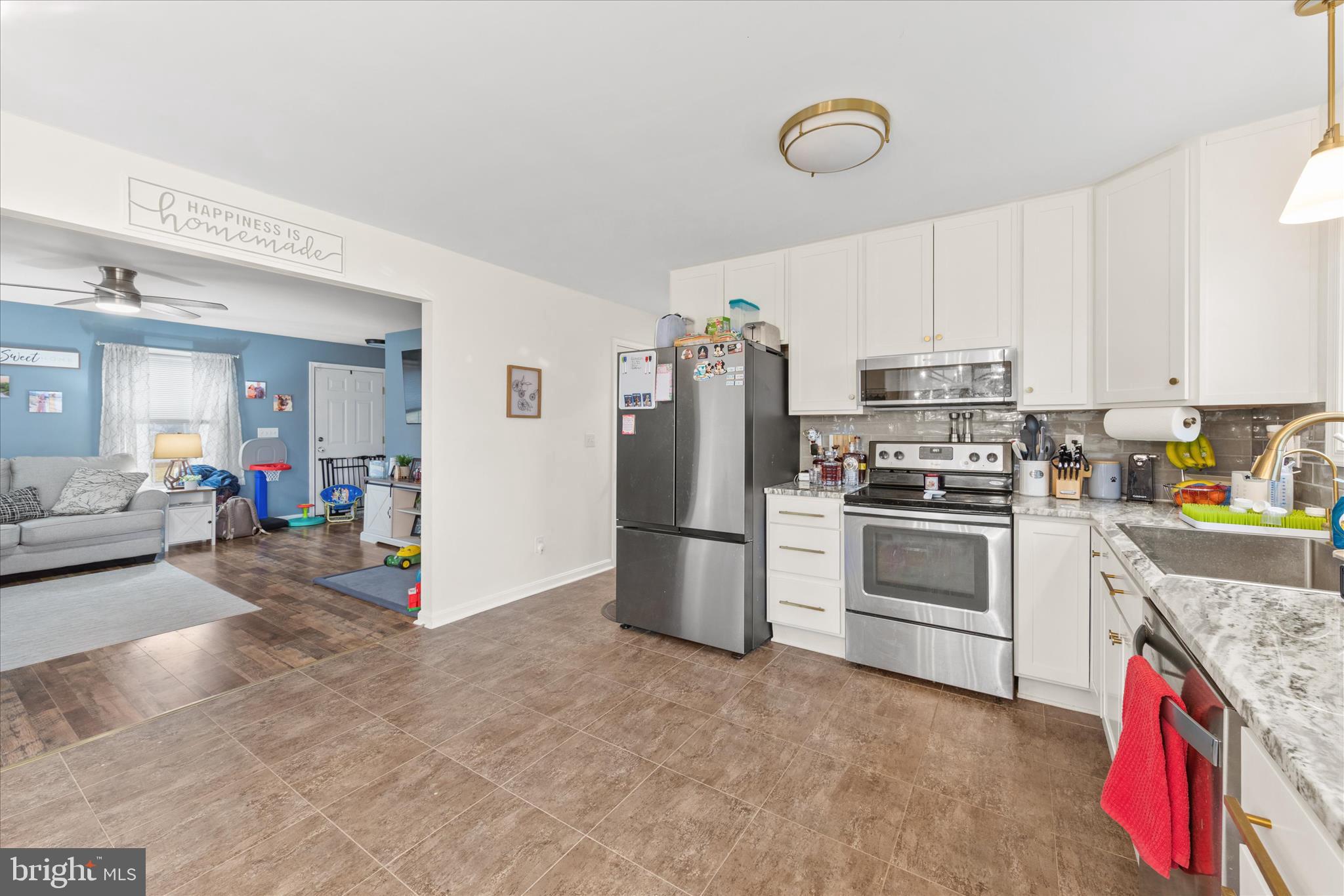 1807 Price Station Road Church Hill, MD 21623 - Photo 16 of 48 a kitchen with a sink cabinets and stainless steel appliances