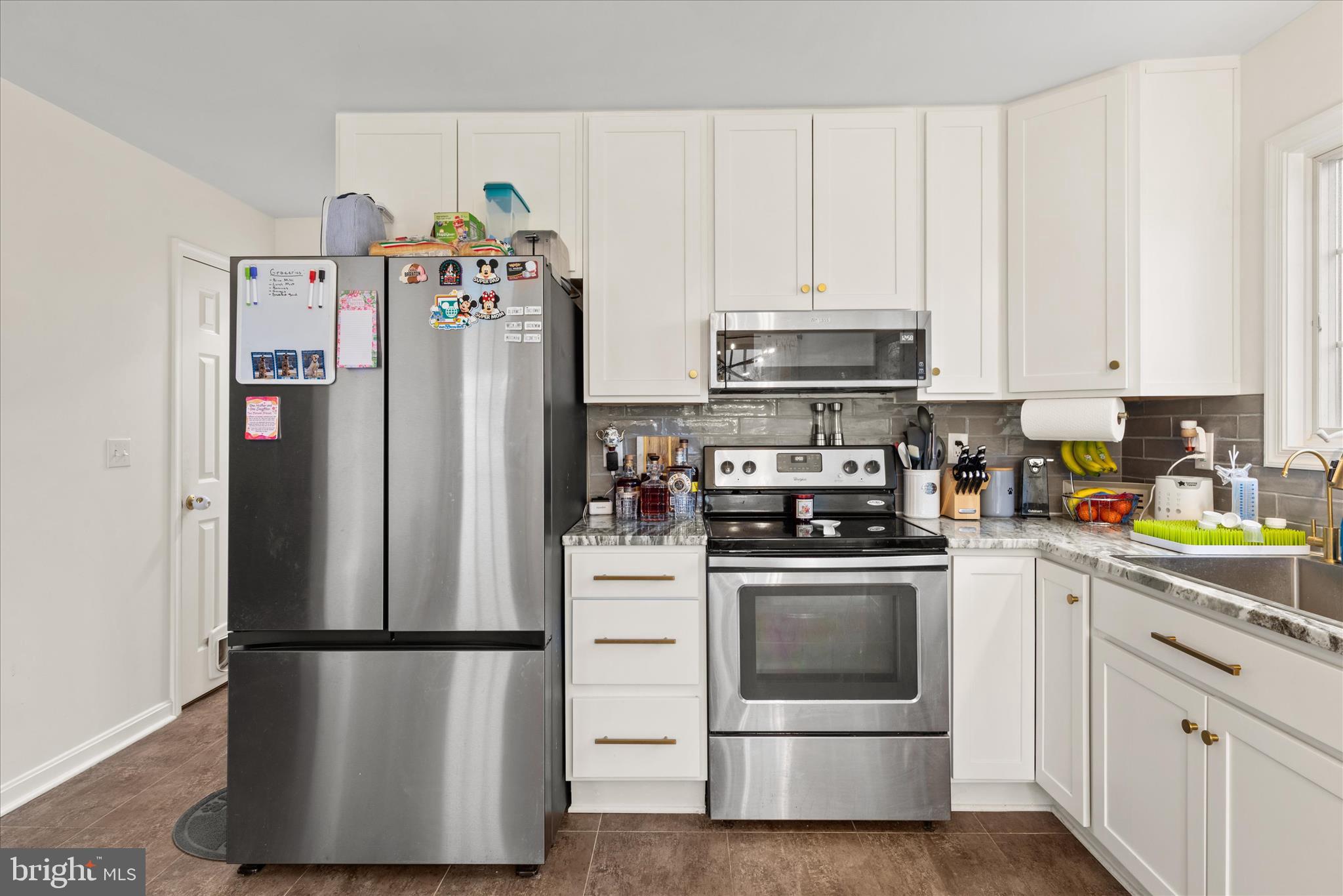 1807 Price Station Road Church Hill, MD 21623 - Photo 20 of 48 a white refrigerator freezer and a stove sitting inside of a kitchen