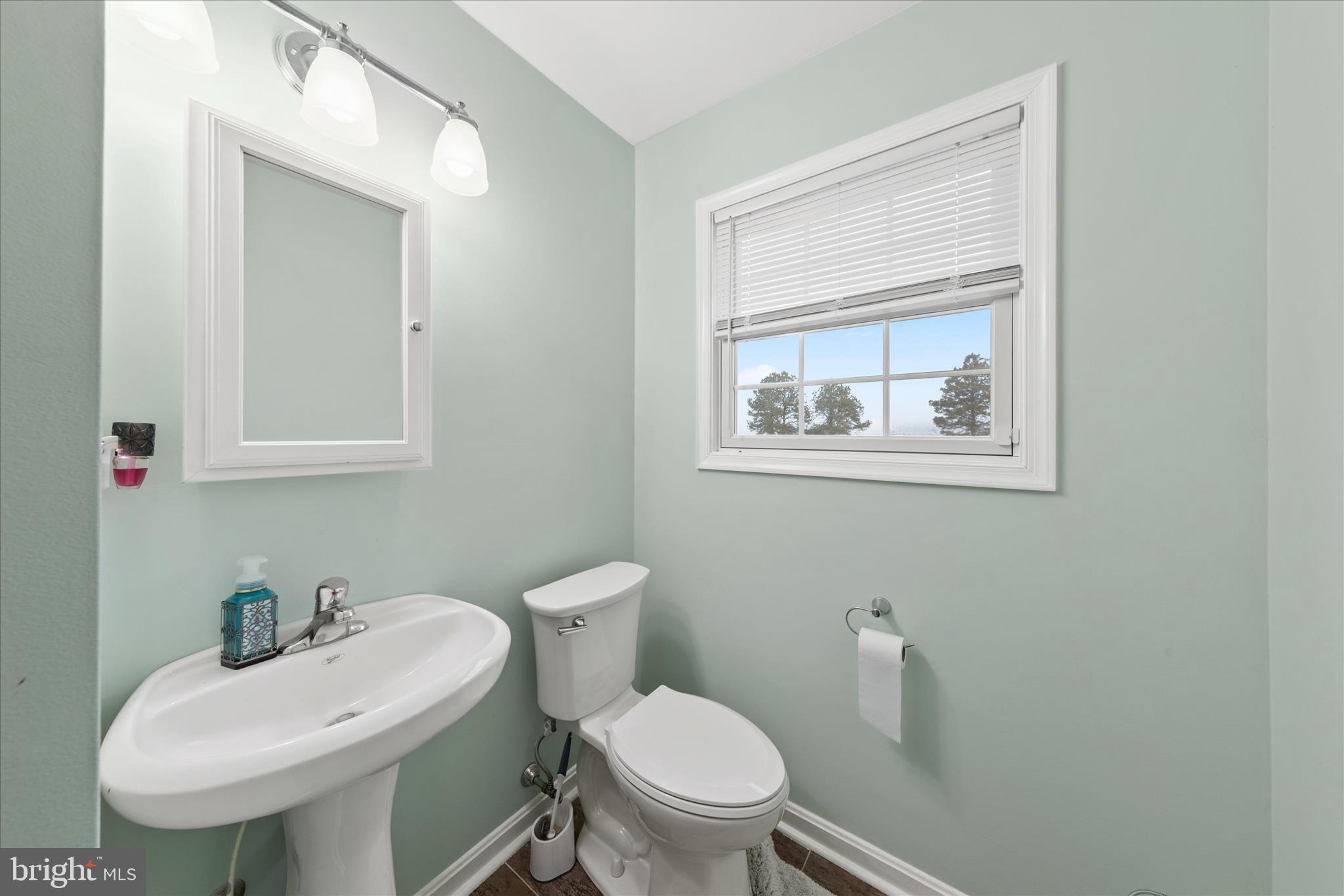 1807 Price Station Road Church Hill, MD 21623 - Photo 41 of 48 a white toilet sitting next to a bathroom sink