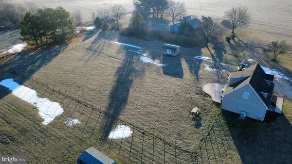 a view of a swimming pool with a yard