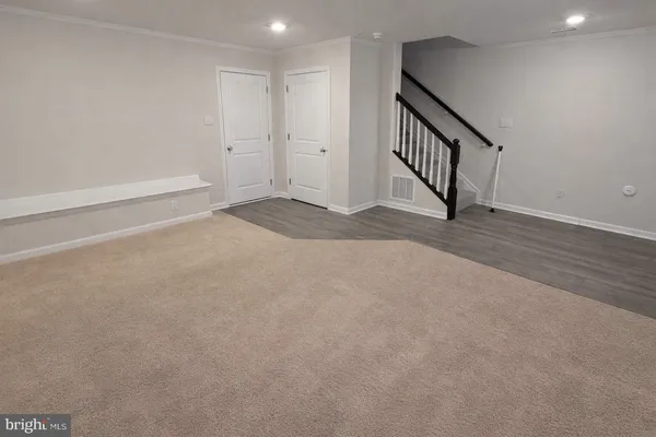 a view of an empty room with stairs